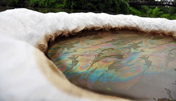 Boom soaking up an oil spill