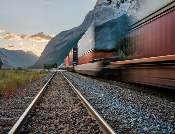 Locomotive next to railroad tracks
