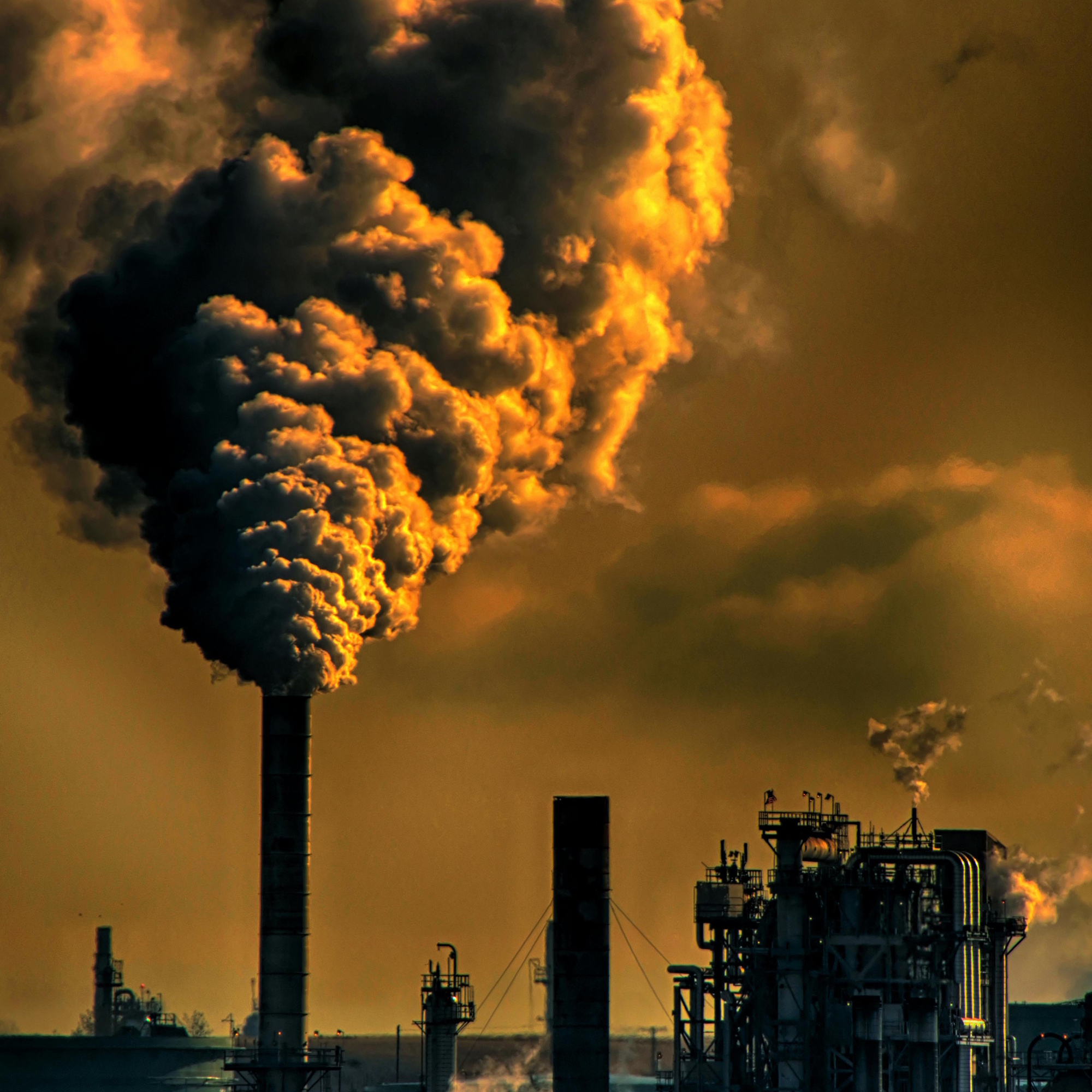 industrial background, with fumes from a pipe